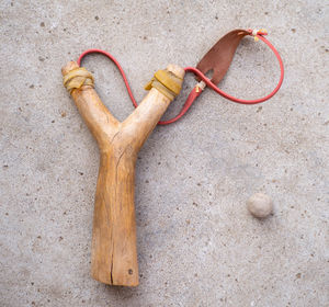 A catapult made of wood and a ball of clay.