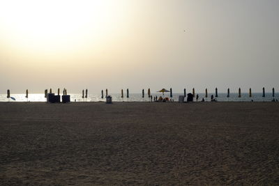 Scenic view of beach against sky during sunset