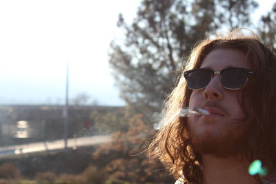 Close-up of man smoking outdoors