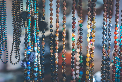 Full frame shot of multi colored decorations hanging at market stall