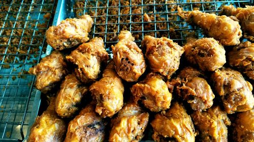 High angle view of meat on barbecue grill