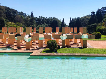 View of swimming pool against blue sky