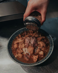 High angle view of person preparing food on table