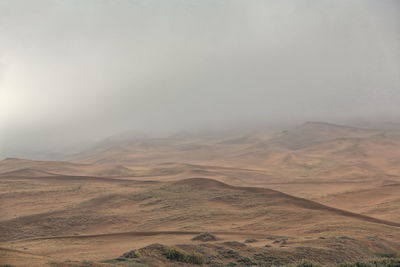 Scenic view of desert against sky