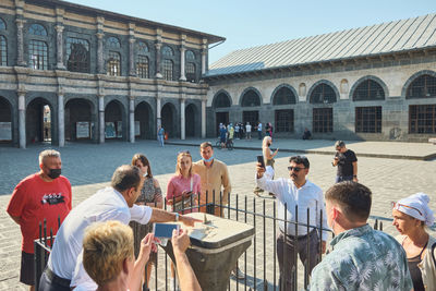 Group of people in front of building