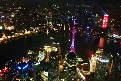 Aerial view of illuminated city at night