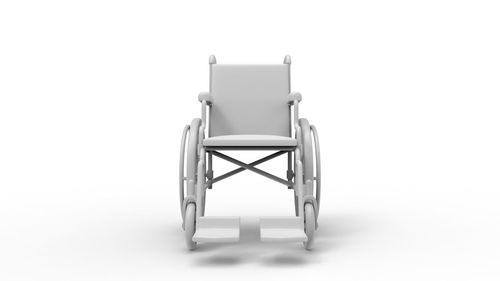 Close-up of empty chair against white background