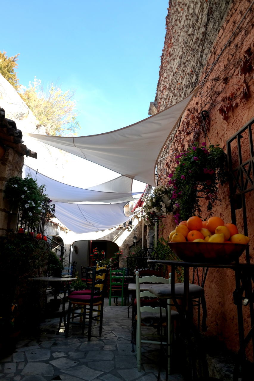 CHAIRS AND TABLE AT RESTAURANT