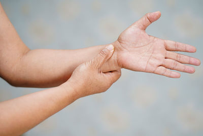 Close-up of hand holding hands