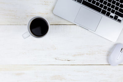 High angle view of coffee cup on table