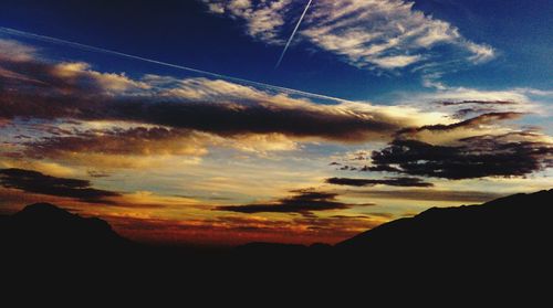 Low angle view of mountain against cloudy sky