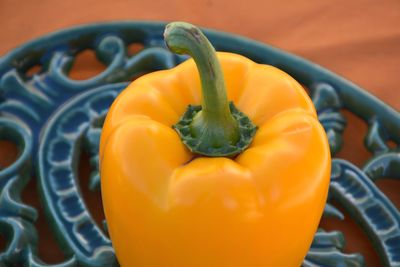 High angle view of orange bell pepper on table