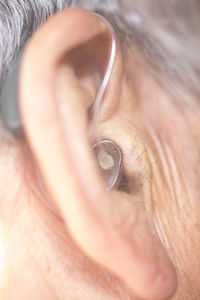 Close-up of man with hearing aid