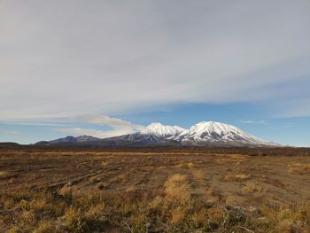 Scenic view of snowcapped mountains against sky