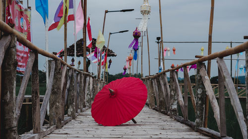 Multi colored umbrellas hanging on footpath