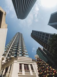 Low angle view of modern buildings against sky
