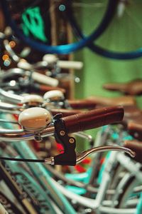 Close-up of bicycle hanging on bicycles