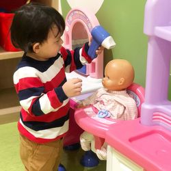 Boy playing with toy toys