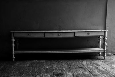 Empty bench against wall at home