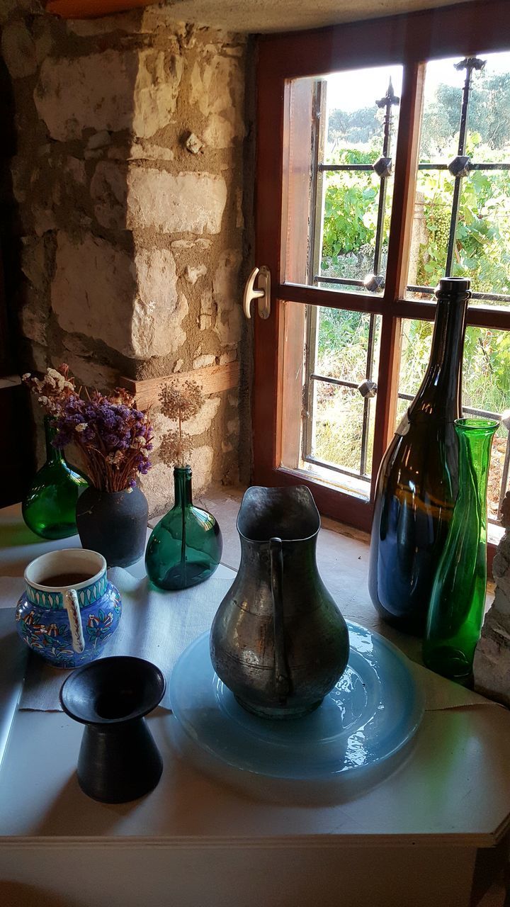 GLASS OF JAR ON TABLE