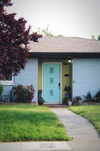 Footpath by building against sky