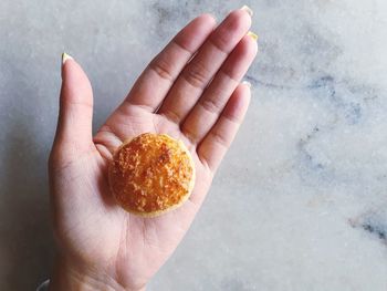 High angle view of hand holding ice cream