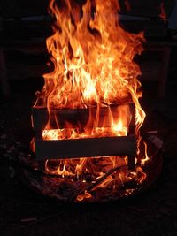 Close-up of fire burning at night