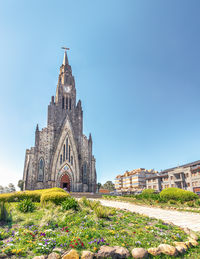 Low angle view of church against clear blue sky