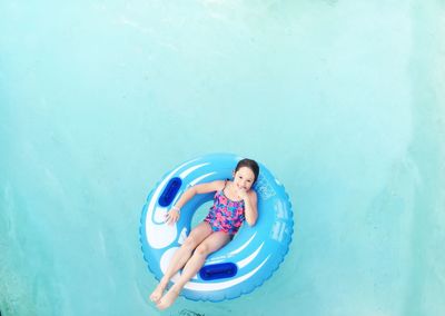 High angle view of woman swimming in pool