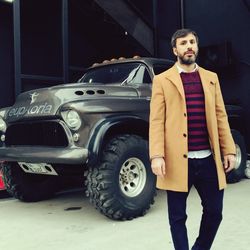 Full length of man standing in car