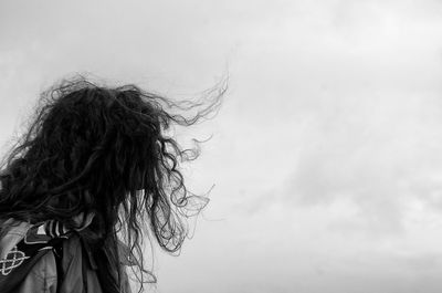 Low angle view of woman against sky