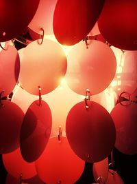 Low angle view of illuminated lanterns hanging on tree