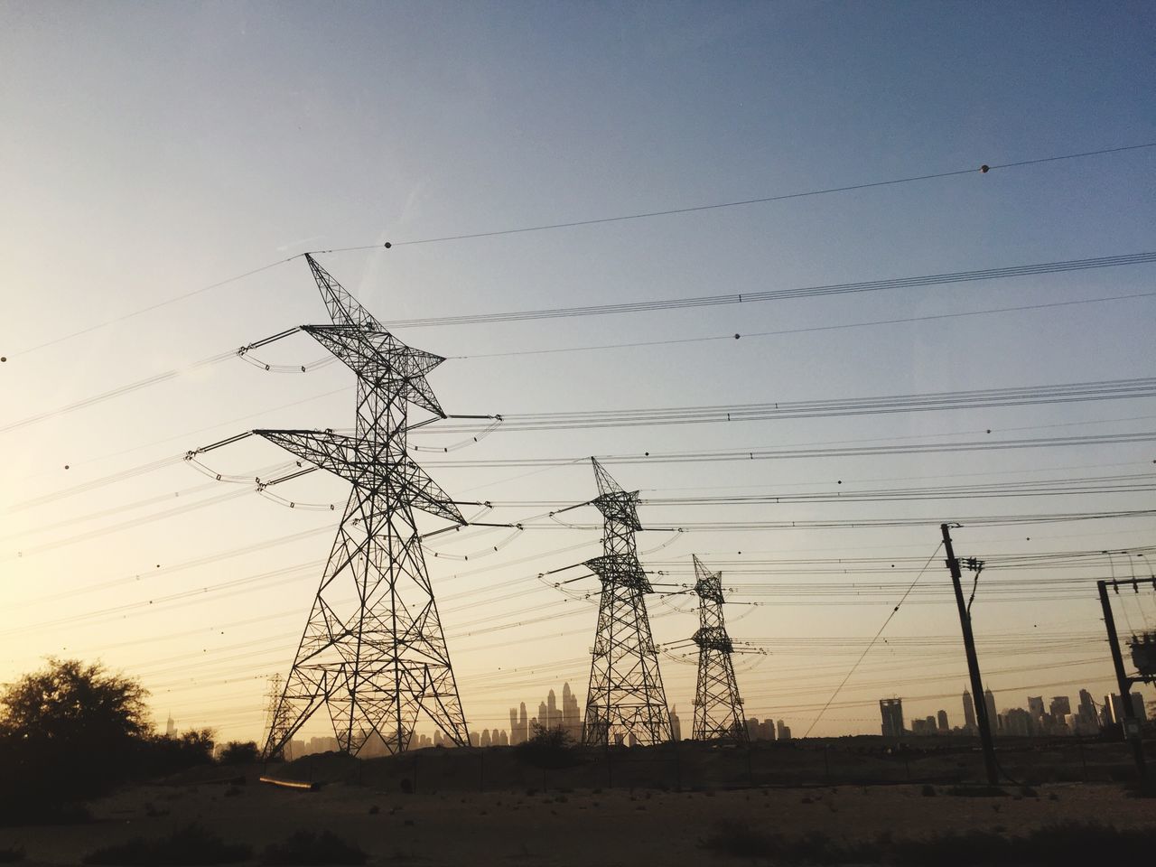 LOW ANGLE VIEW OF ELECTRICITY PYLONS AGAINST SKY