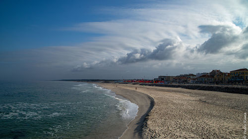 Scenic view of beach against sky