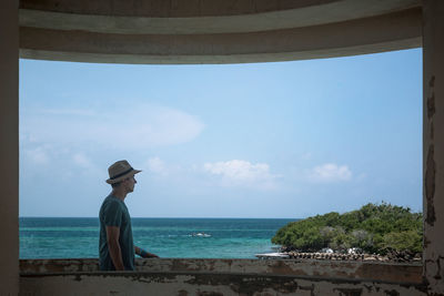 Man looking at sea against sky