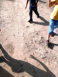 Low section of people walking on road