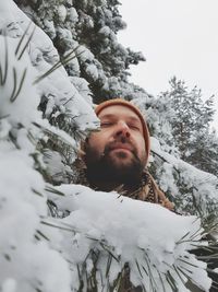 Portrait of young man in snow