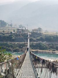 Footbridge leading towards mountains