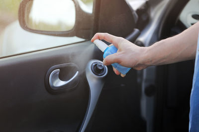 Midsection of man washing car