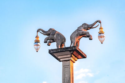 Low angle view of statue against clear sky