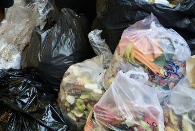 Close-up of stacked garbage bags