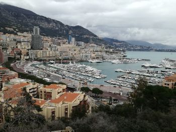 High angle view of townscape by sea