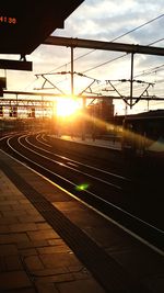 View of railroad tracks at sunset