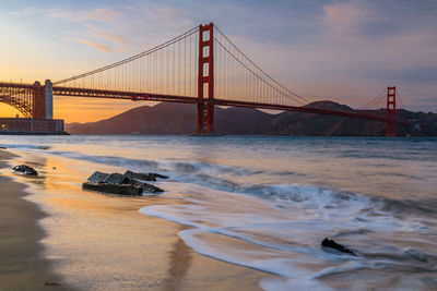 View of suspension bridge at sunset