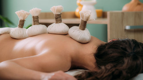 Ayurveda kizhi massage with herbal bolus bags