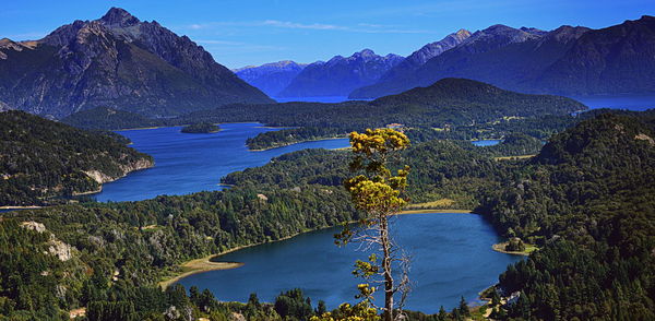 Scenic view of lake and mountains against sky