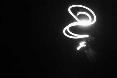 Close-up of illuminated light bulb