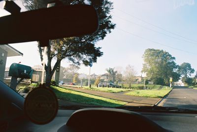 Scenic view of landscape seen through car windshield