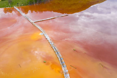 Aerial view of mining settling basin and lime supply. colorful polluted mine water geamana, romania