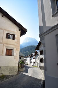 Houses in town against sky